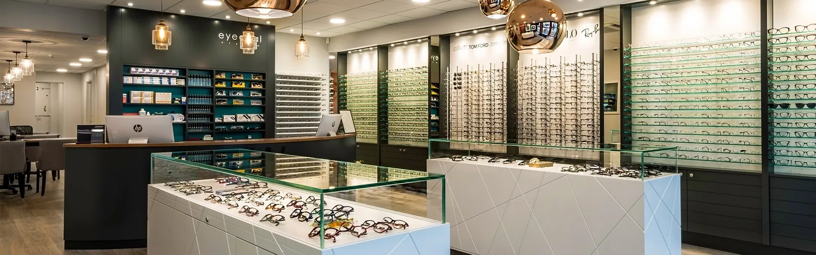 Finished Eyedeal Vision optician showroom in Chingford with new downlights and pendant lighting