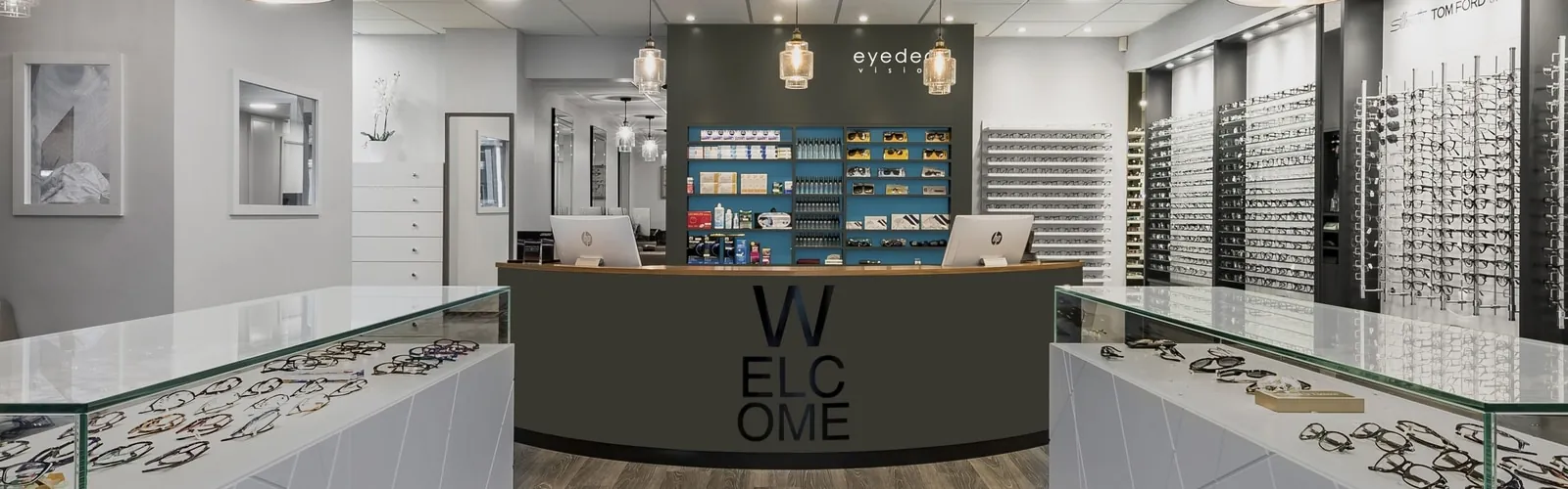 Eyedeal Vision reception area in Chingford with new downlights and pendant lighting