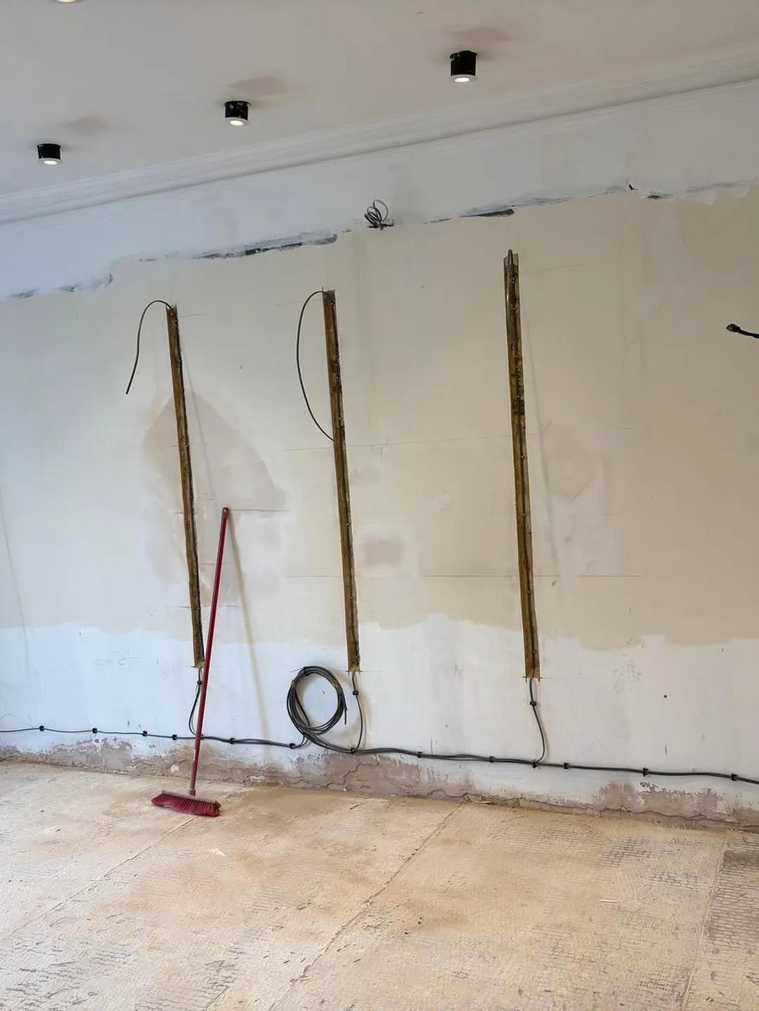 First-fix cables run in chased walls before plastering