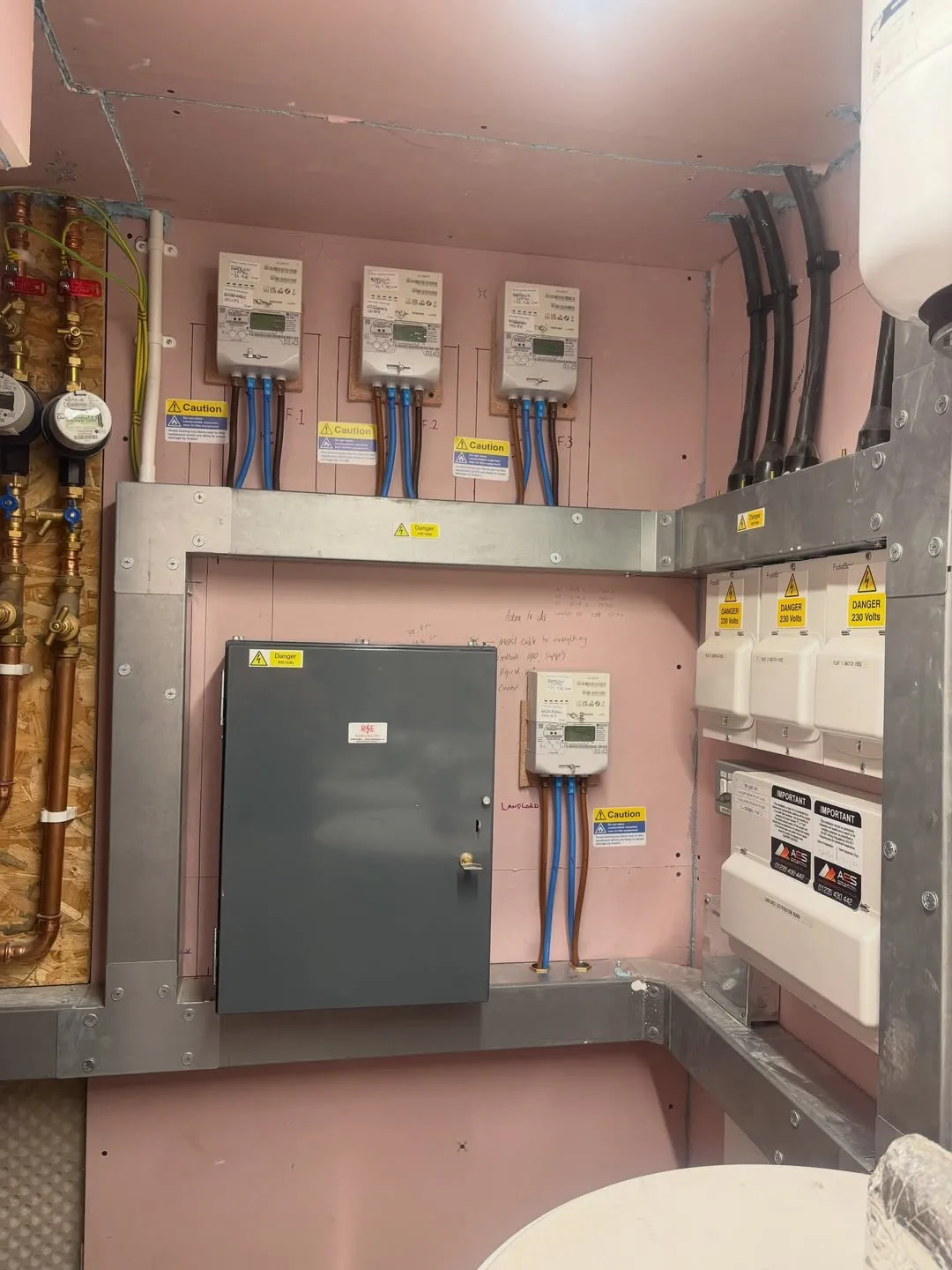 Meter room with several meters and distribution boards for a block of flats