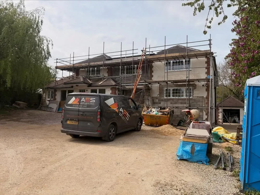 Adtec van on site at a house extension with scaffolding
