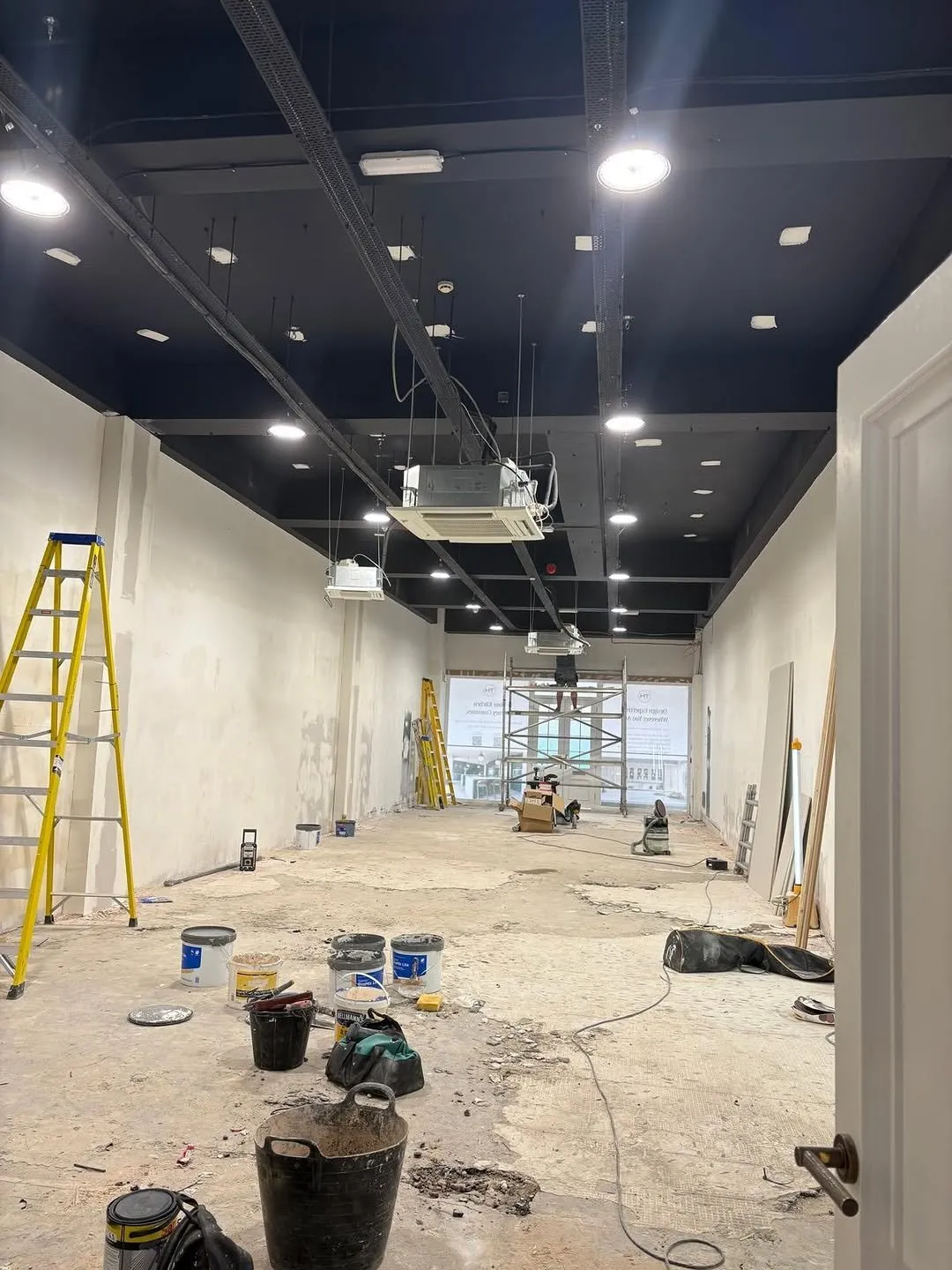 Commercial unit fit-out with new LED downlights and ceiling air conditioning cassettes