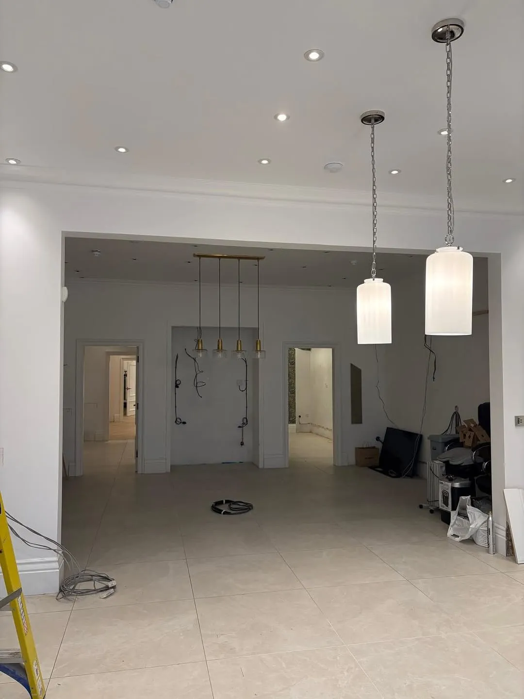 Finished commercial interior with pendant and recessed lighting